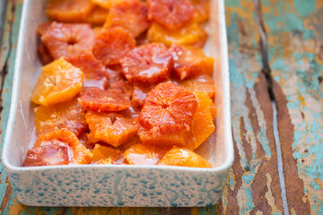 Slices of blood orange covered in sugar