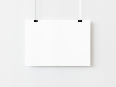One blank horizontal rectangle poster template hanging on thread with paper clips on white background. 3D illustration