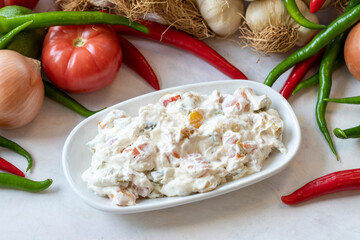 Panco appetizer prepared with potatoes, yogurt and peppers. Traditional Turkish and Arabic cuisine meze. Snack meal served alongside the main course. Natural vegetarian food. Local name Panco mezze