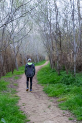 Obraz premium Defocused image of man walking along a path along the river near the Montserrat mountains in Catalonia, Spain.