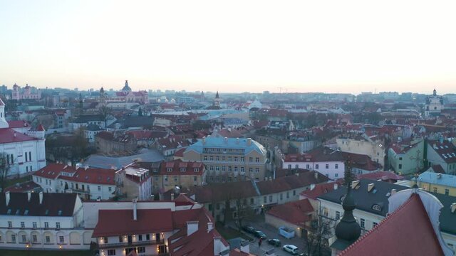Flying over Vilnius Old town on beautiful day. Aerial wide shot.
