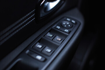 Electric power window control panel. Modern car interior.