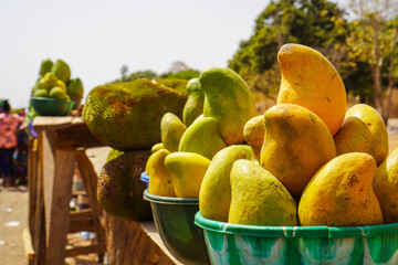 A basket of Mangoes on display at a road side market