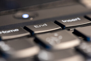 Macro shot of black keyboard focus on end key.