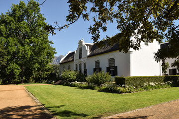 A beautiful building and trees in a sunny day in the winery. Stellenbosch, South Africa.