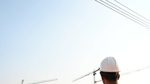 Engineers discuss about work of large building underconstruction