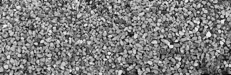 gravel stone texture. grey background with textured rock surface. ancient outdoor construction nuance. abstract rough material. 