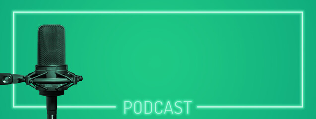 Podcast green background with studio microphone in a neon sign frame and copy space for text