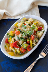 Anamur salad appetizer prepared with many vegetables. Traditional Middle Eastern appetizers with the main course. Layout on dark wood