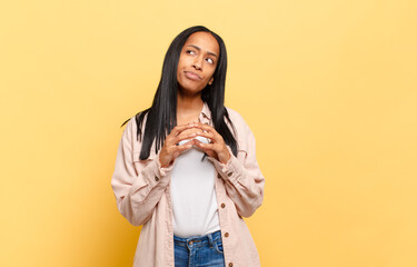 young black woman scheming and conspiring, thinking devious tricks and cheats, cunning and betraying