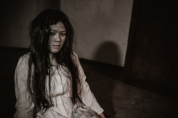 Portrait of asian woman make up ghost,Scary horror scene for background,Halloween festival concept,Ghost movies poster