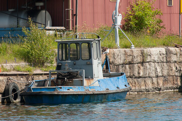 Fototapeta na wymiar Small fisher boat in a haven of south Sweden