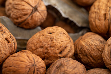 Close-up walnuts pile. Walnut cracker