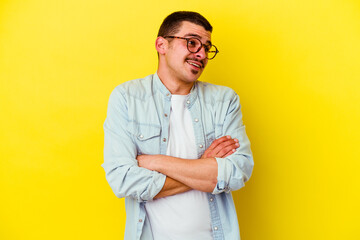 Young caucasian cool man isolated on yellow background dreaming of achieving goals and purposes