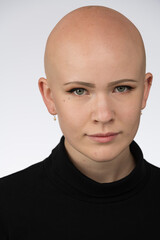 Young urban woman with blue eyes and a fair complexion poses for the camera.