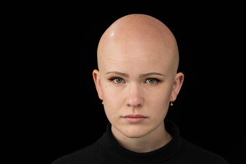 Fototapeta premium Young urban woman with blue eyes and a fair complexion poses for the camera.