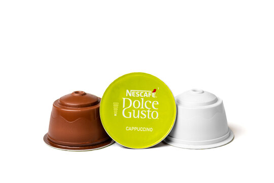 January 2021,Milan, Italy Set of Nescafe Dolce Gusto coffee capsules isolated on white background Top view Flat lay Drink obtained from dosed capsule with roasted, ground, compressed natural coffee