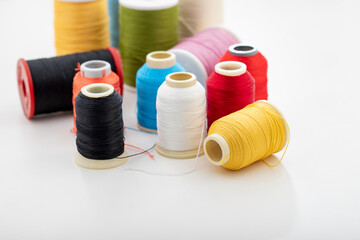 Different colored yarn on white background