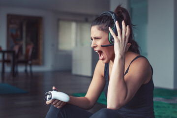 Young angry gamer woman shouting