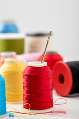 Different colored yarn on white background. Close up. Selective Focus