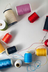 Different colored yarn on white background. Top view. writing area