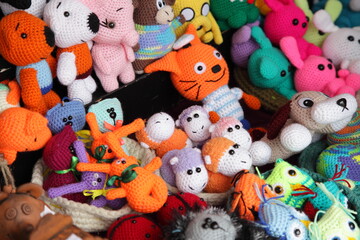 Fototapeta na wymiar A many colored cute fluffy animals toys