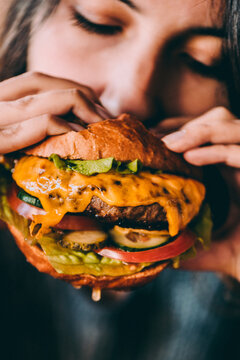 person eating  cheeseburger