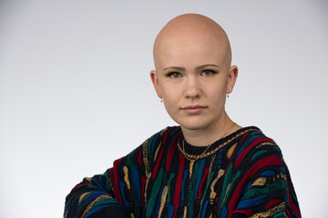 Young urban woman with blue eyes and a fair complexion poses for the camera.