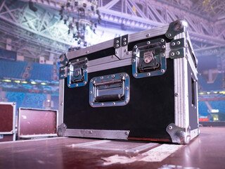 Box rack for transportation of concert equipment. Wardrobe trunk on background of concert venue....