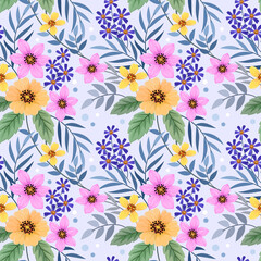 Amazing seamless floral pattern with bright colorful flowers and leaves on a light blue background.