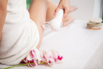 Obraz na płótnie Canvas Woman getting LPG massage for skin care in home