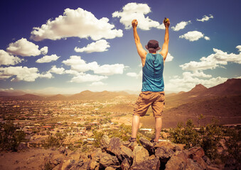 hiker reaching the peak