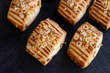 Homemade fresh raisin on cookies with nut particles. close up