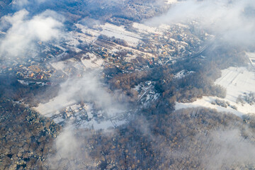 Aerial winter forest, trees and snow in Poland.