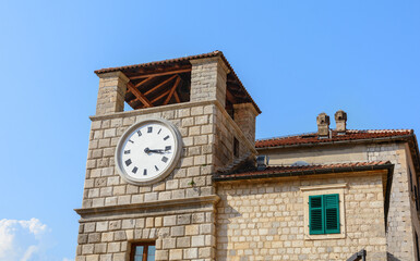 Clock tower in the Old Town of Kotor. Armory Square. Montenegro