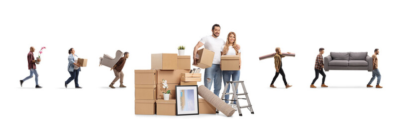 Young couple with a pile of cardboard boxes packing for home removal and other people in the back...
