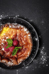 Homemade cheesecake with blueberries, currants, strawberries and mint leaves from above. Flat lay