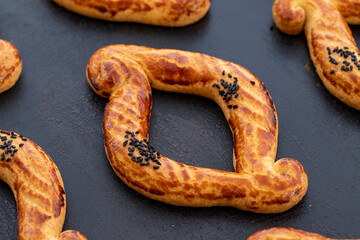 Freshly baked bagels in a baking tray