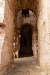 Naklejka premium Vaulted corridor leading into the darkness of the Amphitheatre of El Jem, Tunisia.