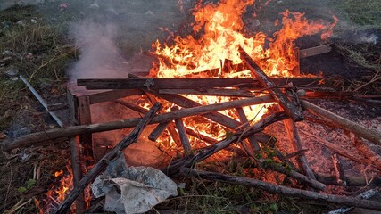 pile of wood burned on fire