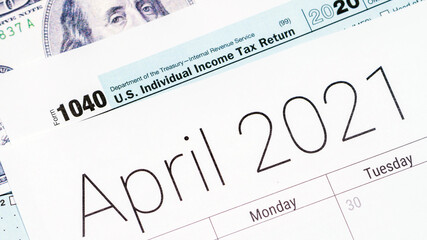 April 2021 calendar with usa 1040 tax day form.