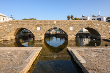 Fototapeta premium Naoussa pedestrian bridge in beautiful Naoussa village on Paros Island. Cyclades, Greece