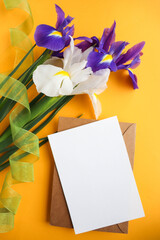 greeting card mockup. spring bouquet. bouquet of irises and space for text 
