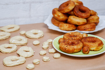 Traditional pastries. Homemade donuts. Photo 6: finished fried donuts are stacked on a plate.