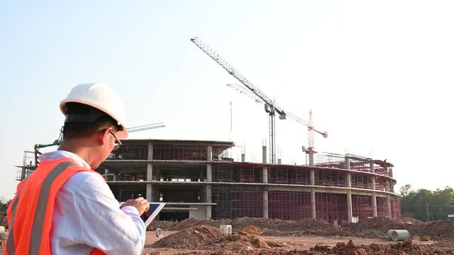 Engineers discuss about work of large building underconstruction