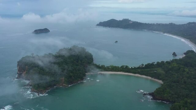 Manuel Antonio National Park tombolo early morning low altitude clouds aerial Costa Rica