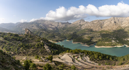 Fototapeta na wymiar panorama view of the Guadalest Reservoir and Sierra de Serella mountains in Spain