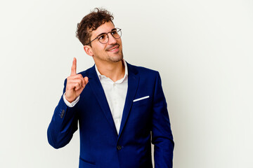 Young business caucasian man isolated on white background indicates with both fore fingers up...