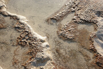 Calcium carbonate mineral deposits close up. Pamukkale travertine surface, Turkey.