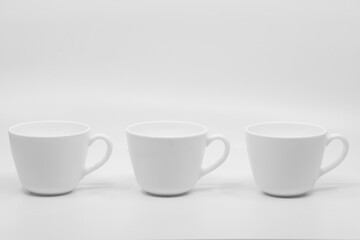 Three cups of coffee isolated on white background with copy space for text